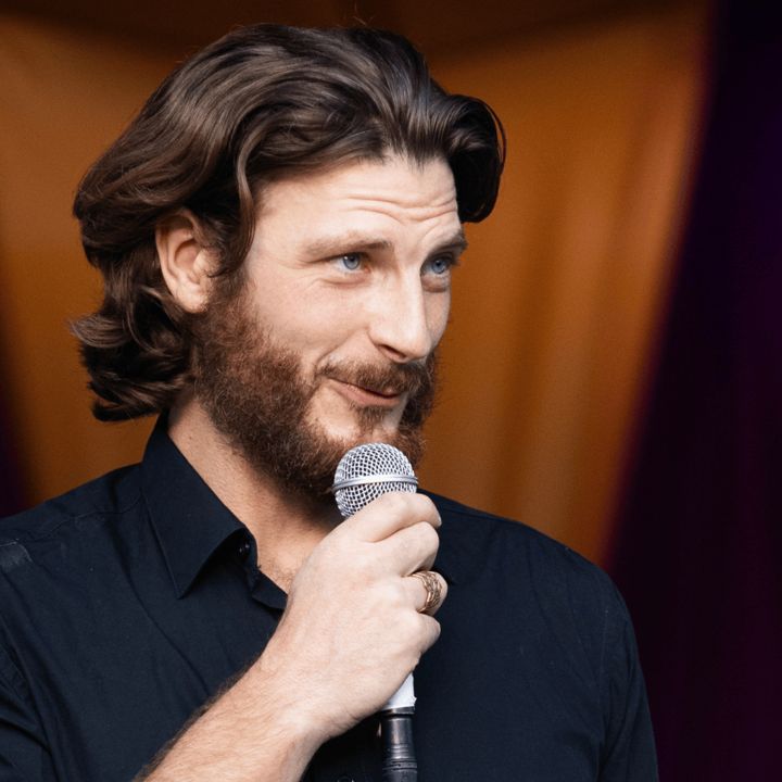 Ian speaking into a microphone